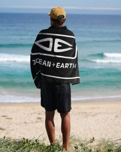 Ocean And Earth Priority Beach Towel Black